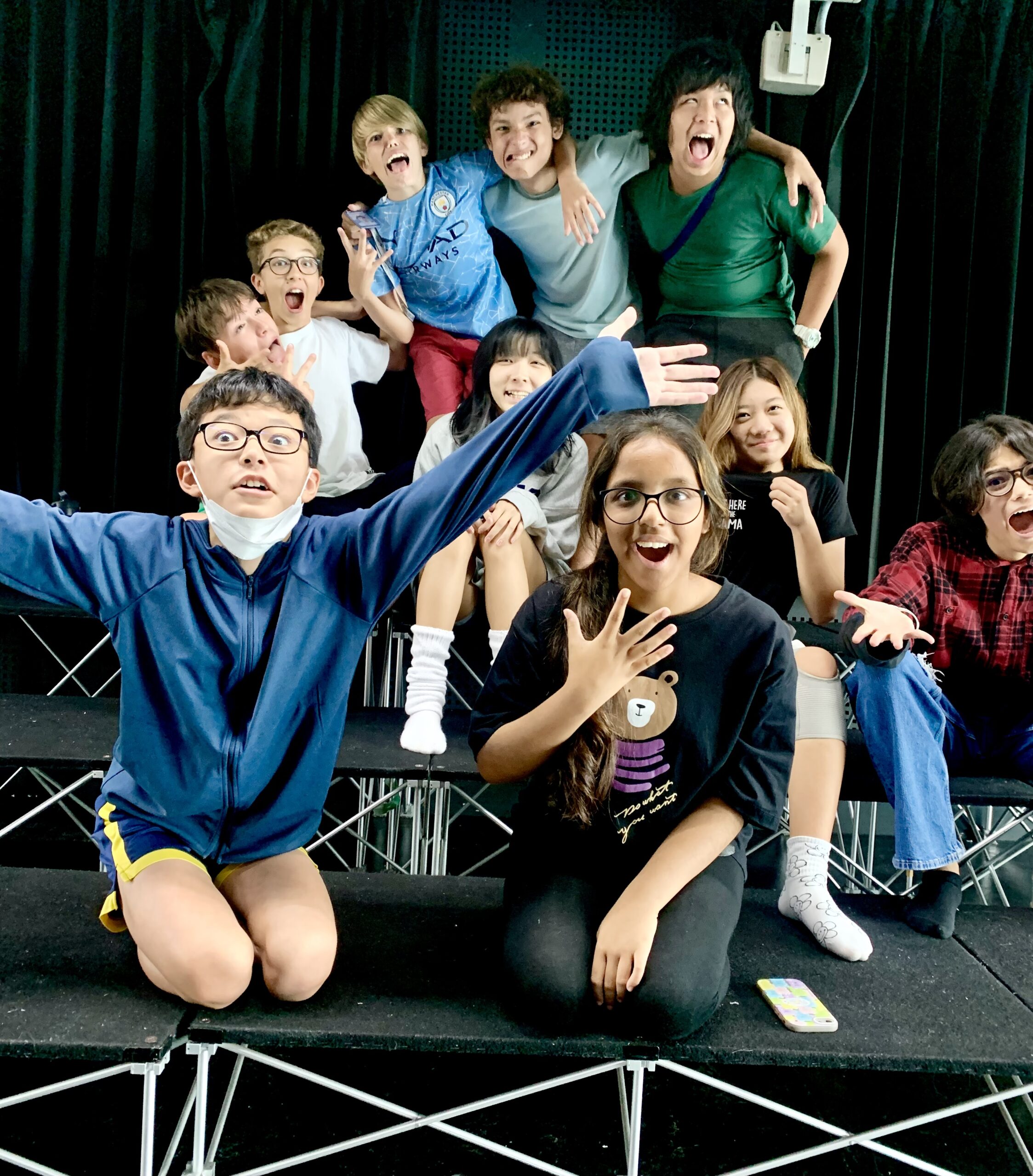 A small group of spade's performing arts students taking a group photo at half-term drama camp.